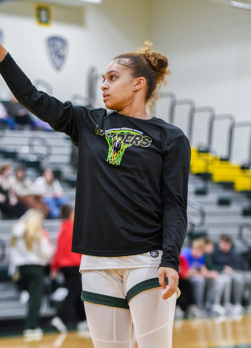 Just getting started, junior Kyleena Potts takes shots before the game to warm up on January 19th.