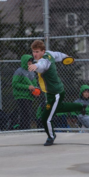 In the discus circle, junior Ben Alexander prepares for a throw at South Relays on April 4.