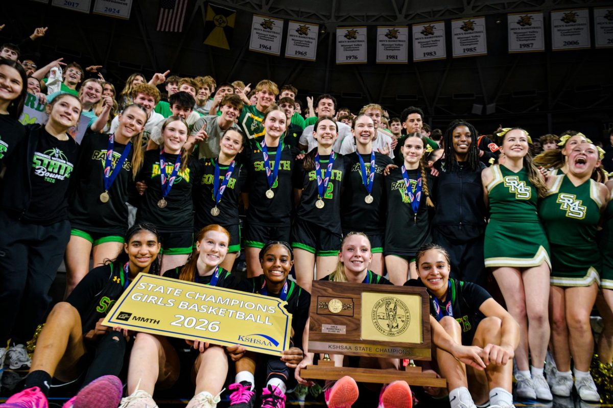 Lady Raiders celebrate with the fans after winning the 2026 Kansas class 6A state championship at Koch Arena
in Wichita. 