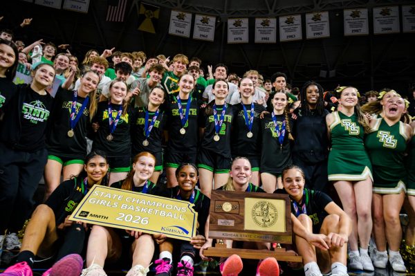 Lady Raiders celebrate with the fans after winning the 2026 Kansas class 6A state championship at Koch Arena
in Wichita.